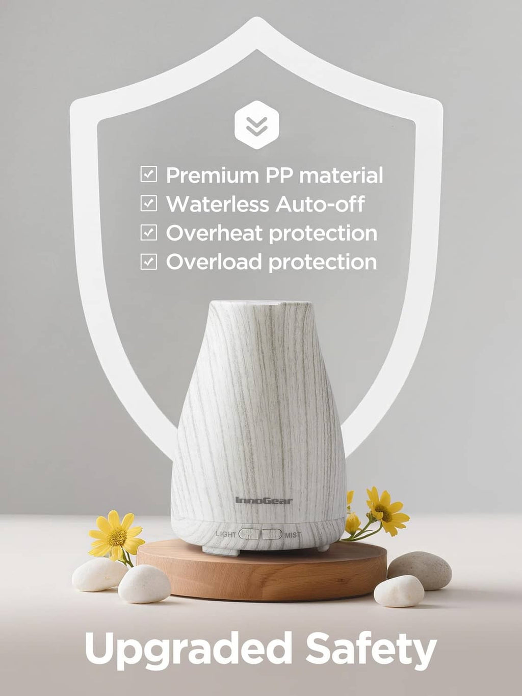 InnoGear essential oil diffuser on wooden base, white-gray textured body