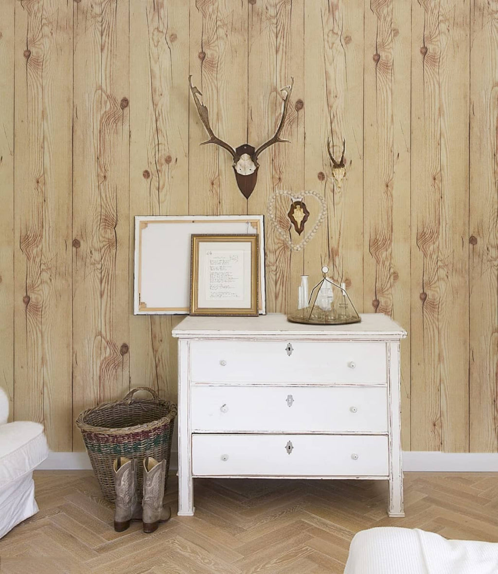 Light tan wood plank peel-and-stick wallpaper with rustic knot speckles