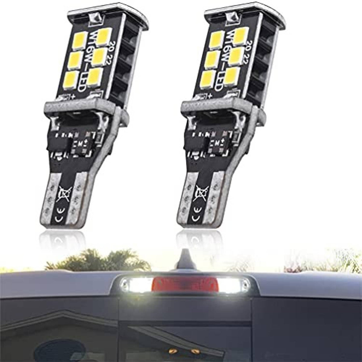 LED third brake light bulbs, two black housings with yellow LED chips and metal stems