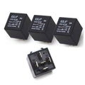 Set of three black automotive relays with printed labels and open 5-pin socket