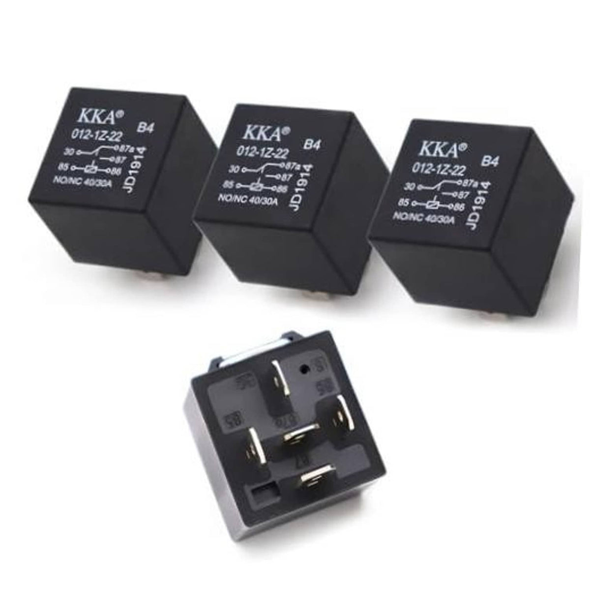 Set of three black automotive relays with printed labels and open 5-pin socket