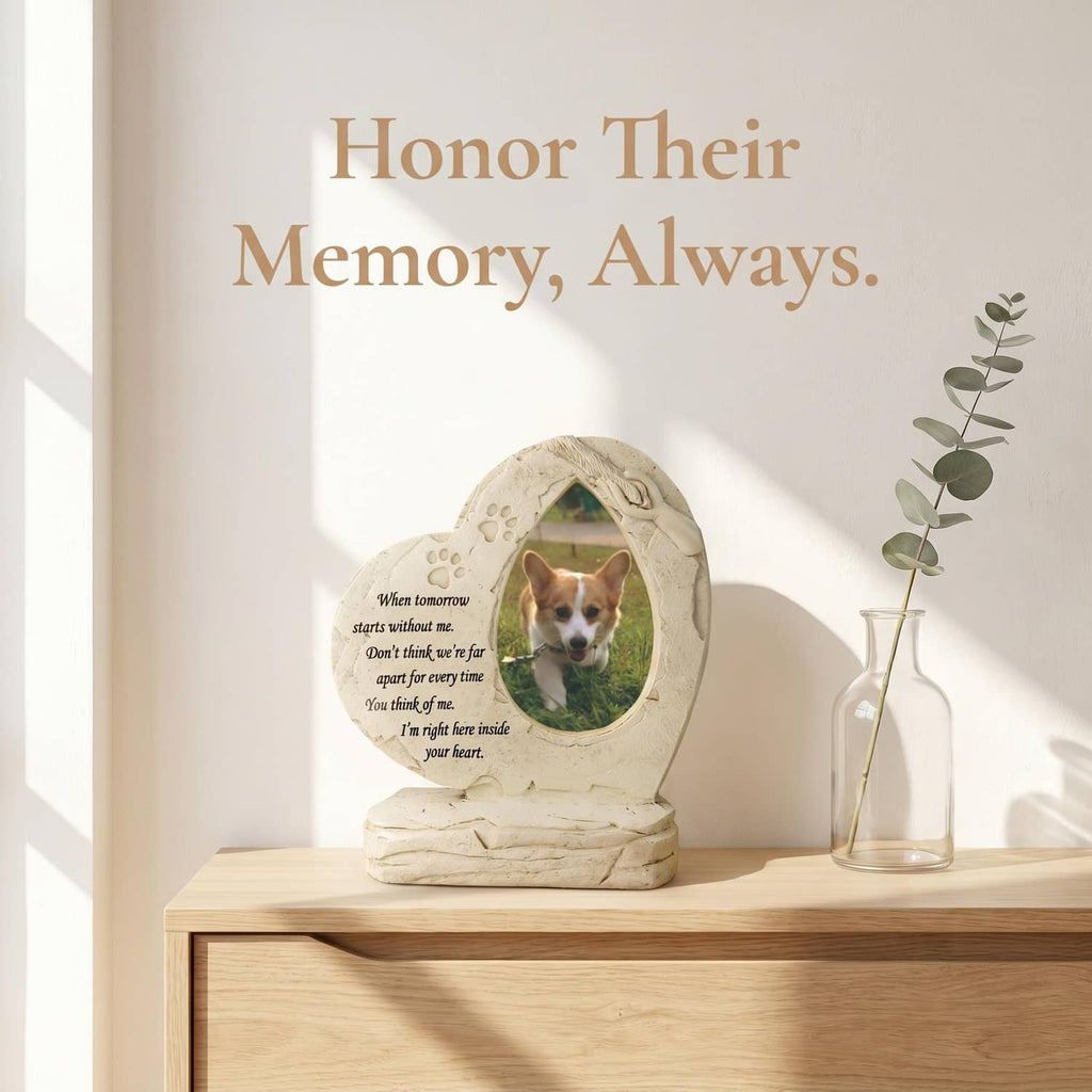 White heart-shaped dog memorial stone with oval photo frame, paw prints, and engraved quote