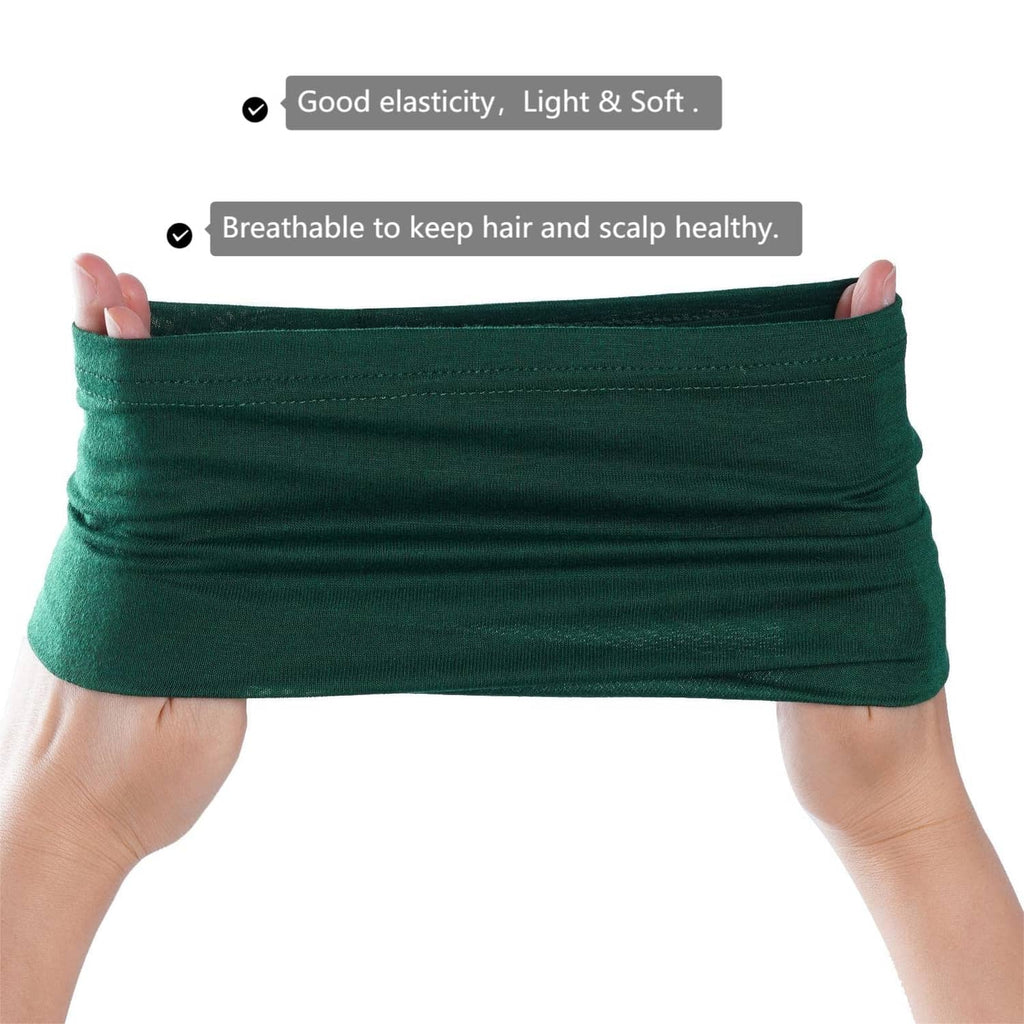 Green tube head wrap cap held between hands, elastic fabric