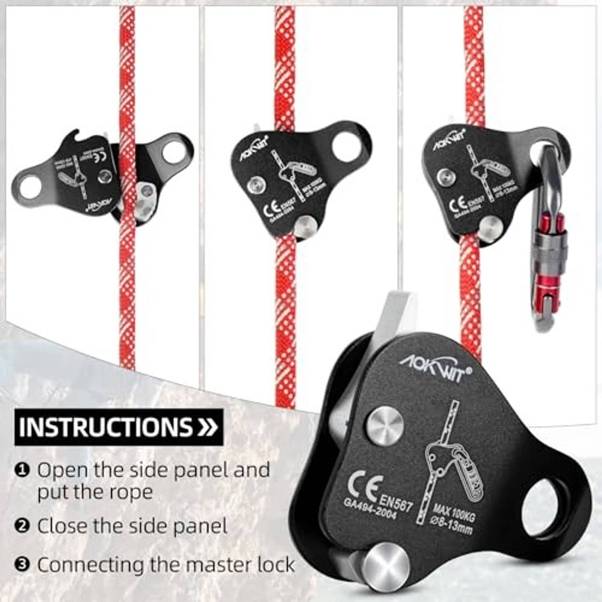 Black rope grab belay device on red rope with silver link hole and red connector