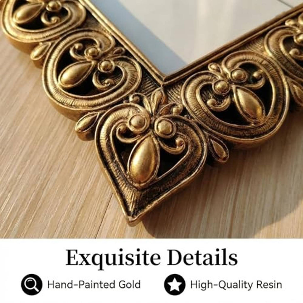 Antique gold photo frame corner detail with carved heart-and-scroll motif