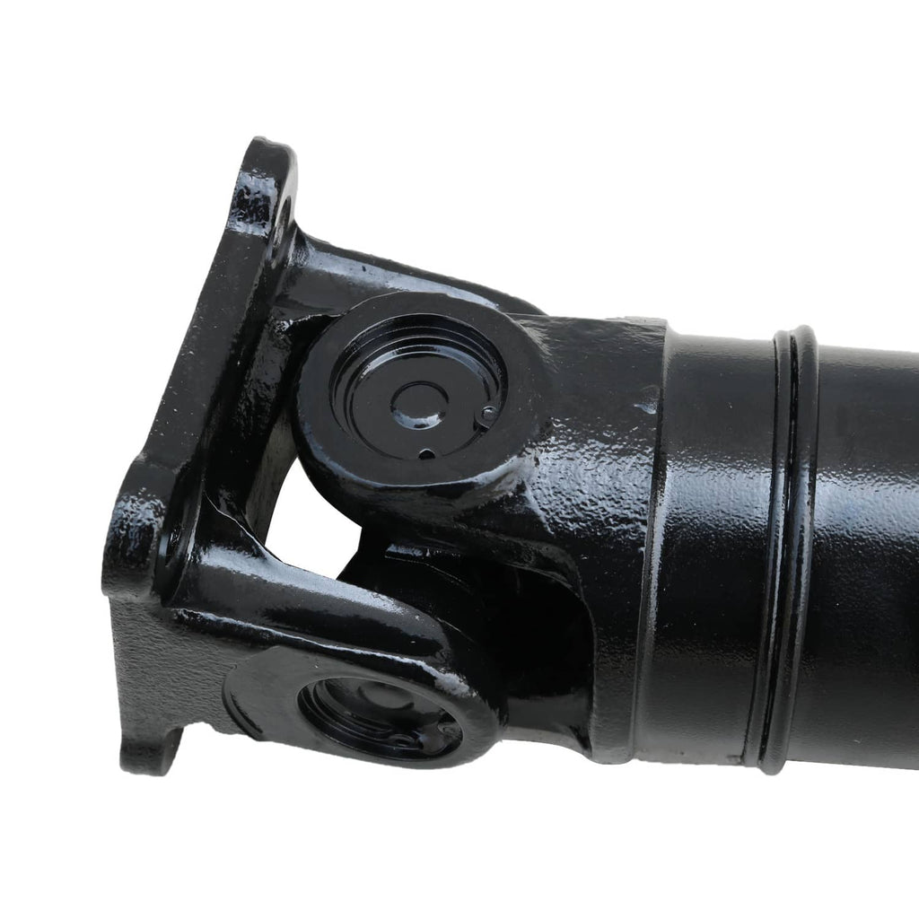 Rear drive shaft yoke and bearing housing on black metal shaft end