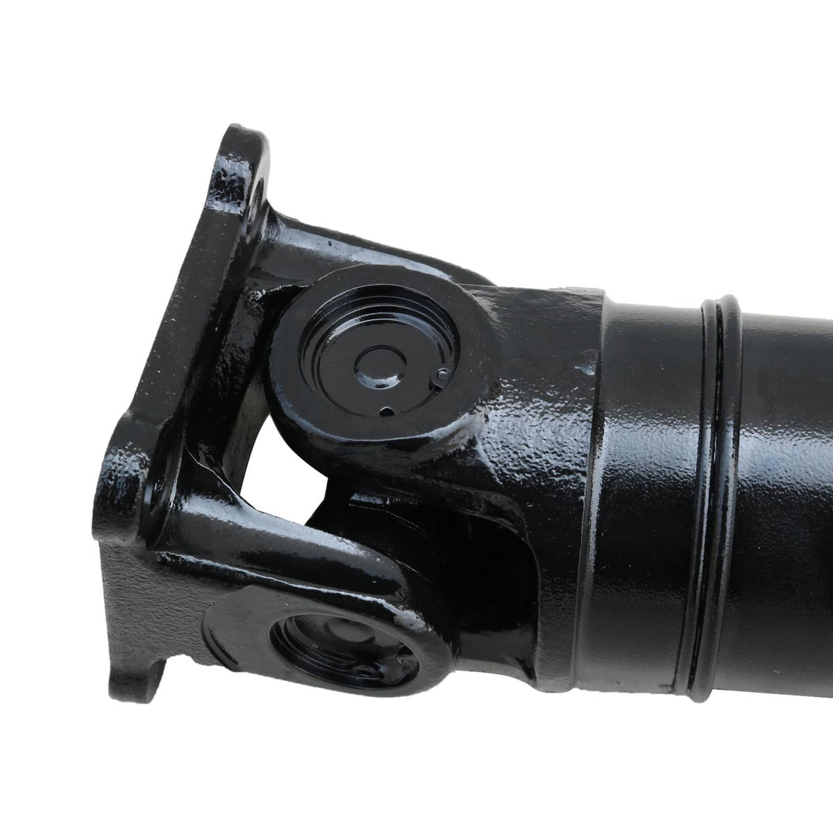 Rear drive shaft yoke and bearing housing on black metal shaft end