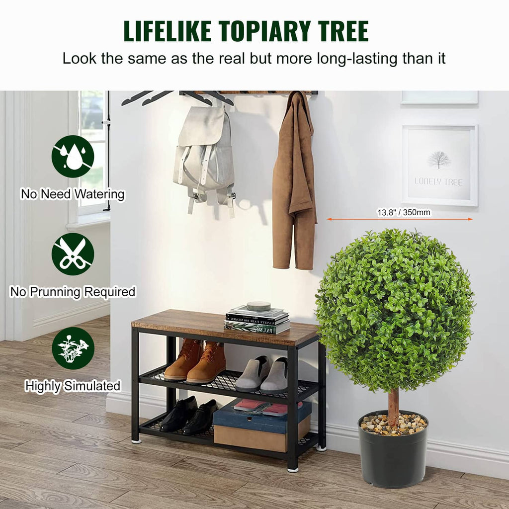 Artificial topiary tree with bright green round leaves in a black pot
