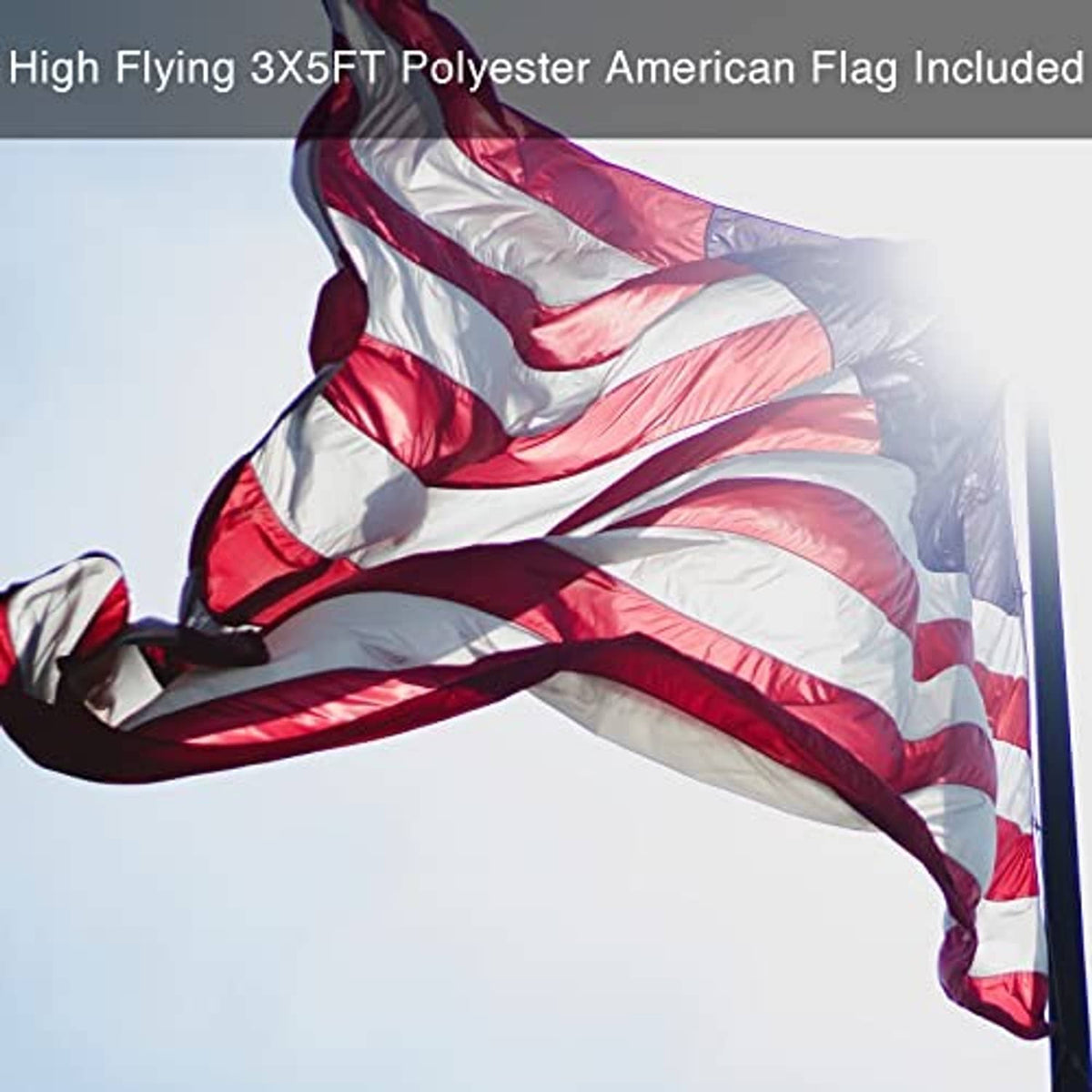 American polyester flag flying on a dark flag pole.