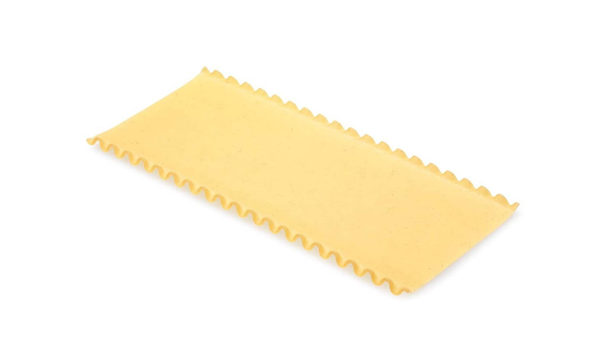Dried lasagne pasta sheet, yellow, folded with wavy edges