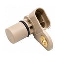 Beige camshaft position sensor with gold mounting flange and black rubber seal