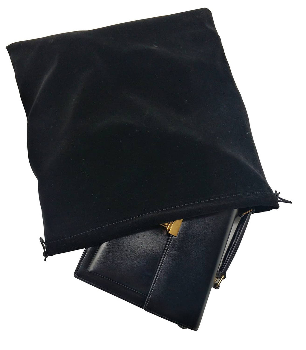 Large black velvet drawstring pouch bags, overlapping stack with cord ties