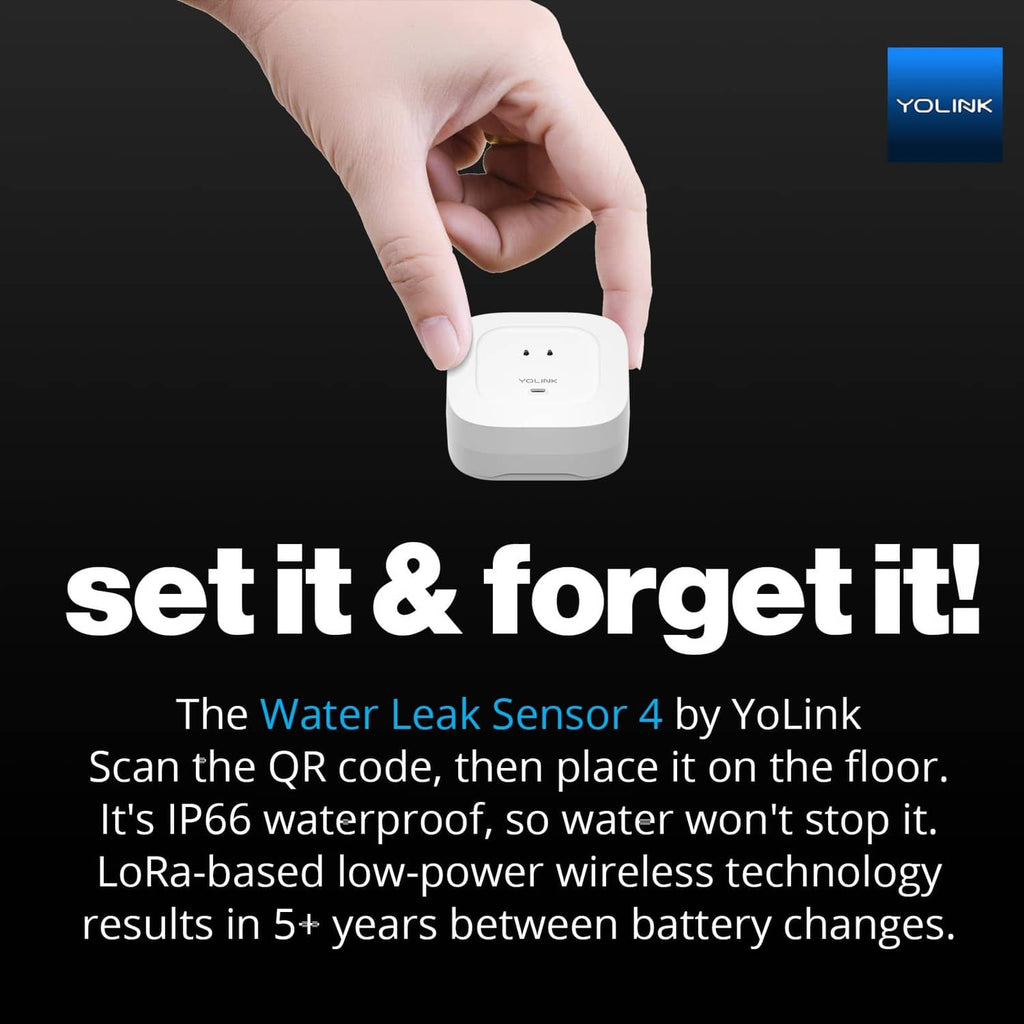 Hand placing YoLink water leak sensor on a floor, white compact device