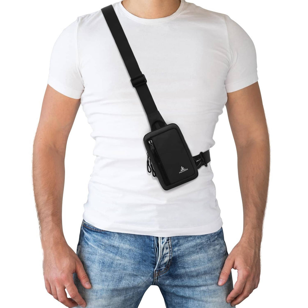 Small black crossbody sling bag worn over shoulder with front zip pocket