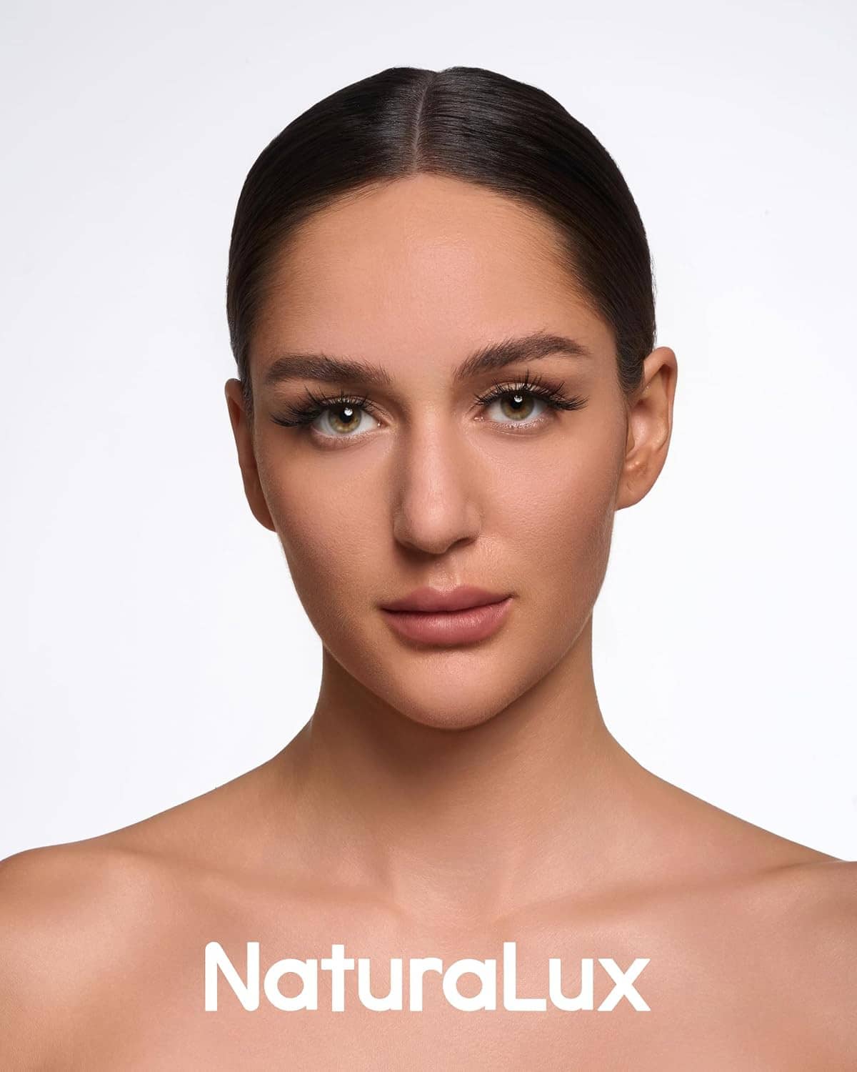 Model with wispy false eyelashes, eye makeup with curled lash look