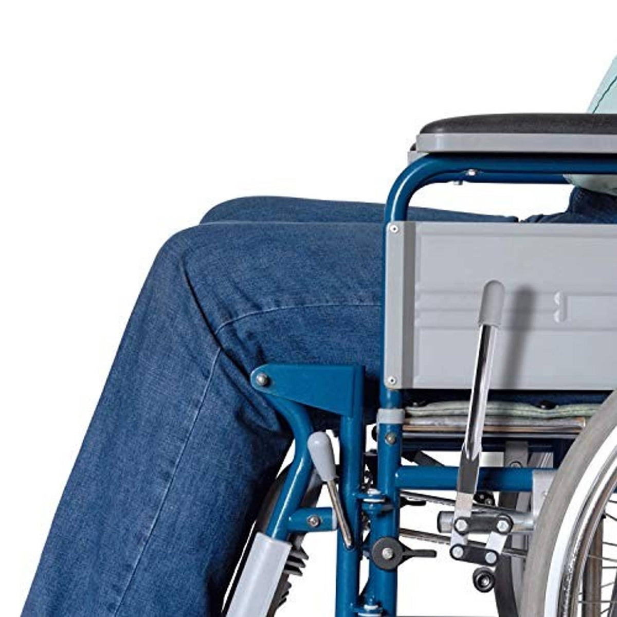 Wheelchair brake handle extension on chair frame, gray grip and silver metal bar