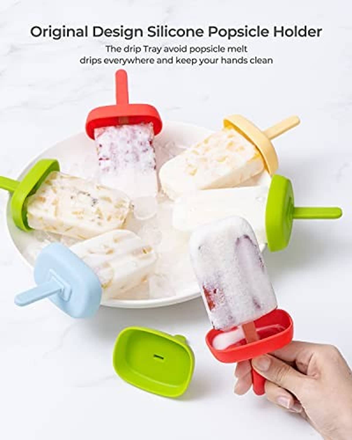 Silicone popsicle holders in green with red and blue lids holding frozen popsicles