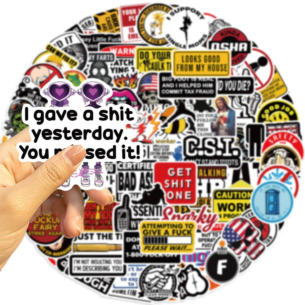 Hand holding humorous hard hat sticker sheet with hearts, bold text, and safety badges