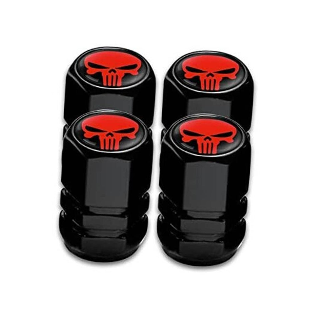 Four black tire valve stem caps with red skull emblem arranged in a square