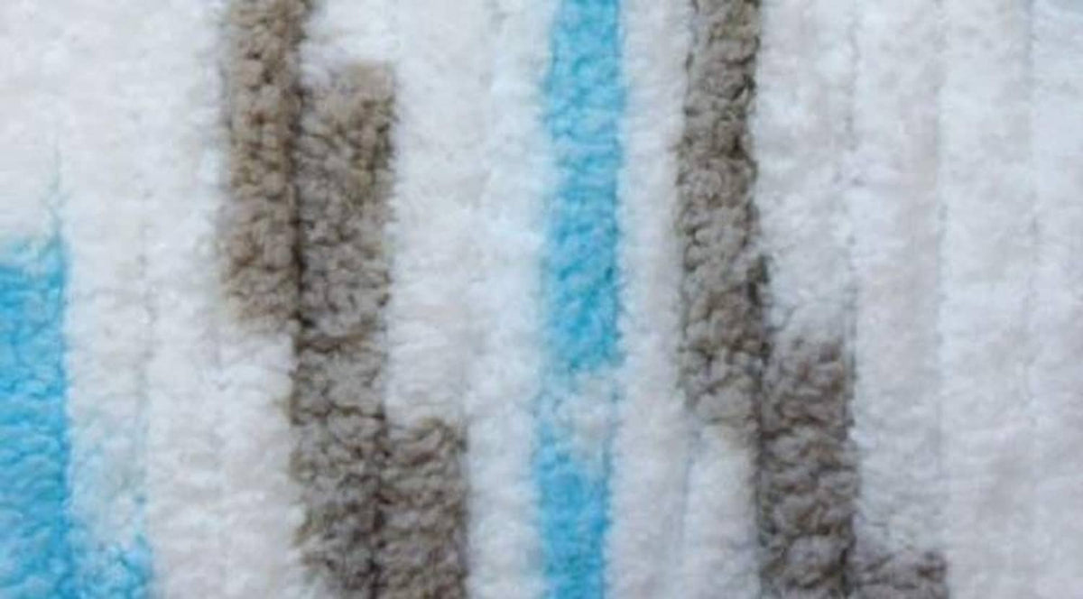 Super bulky striped yarn texture in light blue, white, and gray