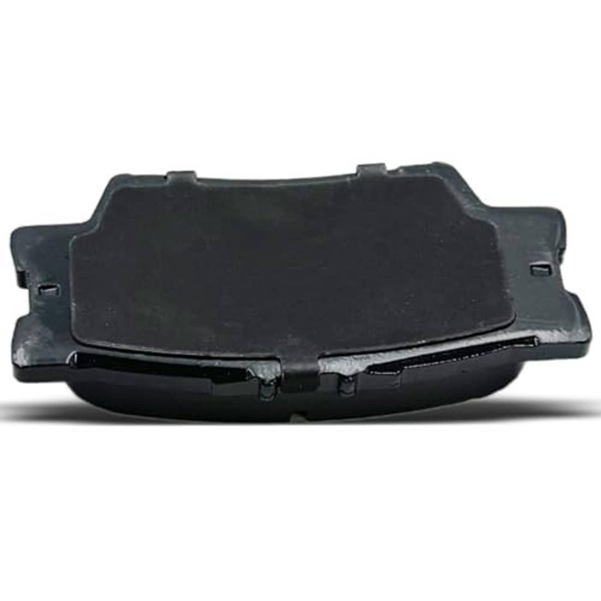 Ceramic brake pad pair close-up, black non-friction side with metal edges