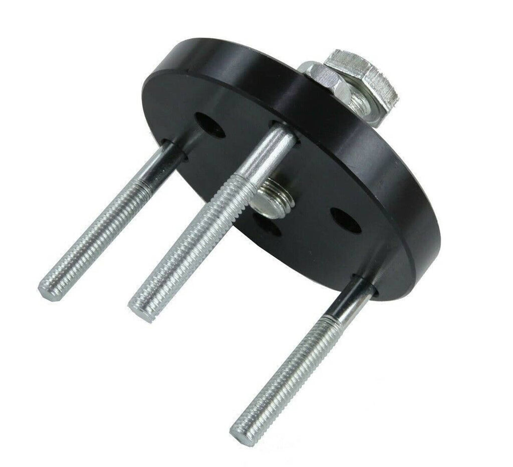 Clutch puller tool adapter with black base and three steel bolts