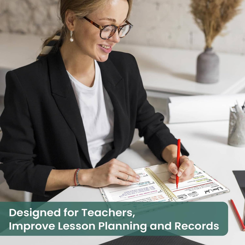 Teacher writing in an academic planner while taking notes with a red pen