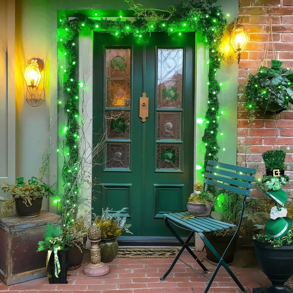 Green LED solar fairy lights wrapped around a front door and window frame