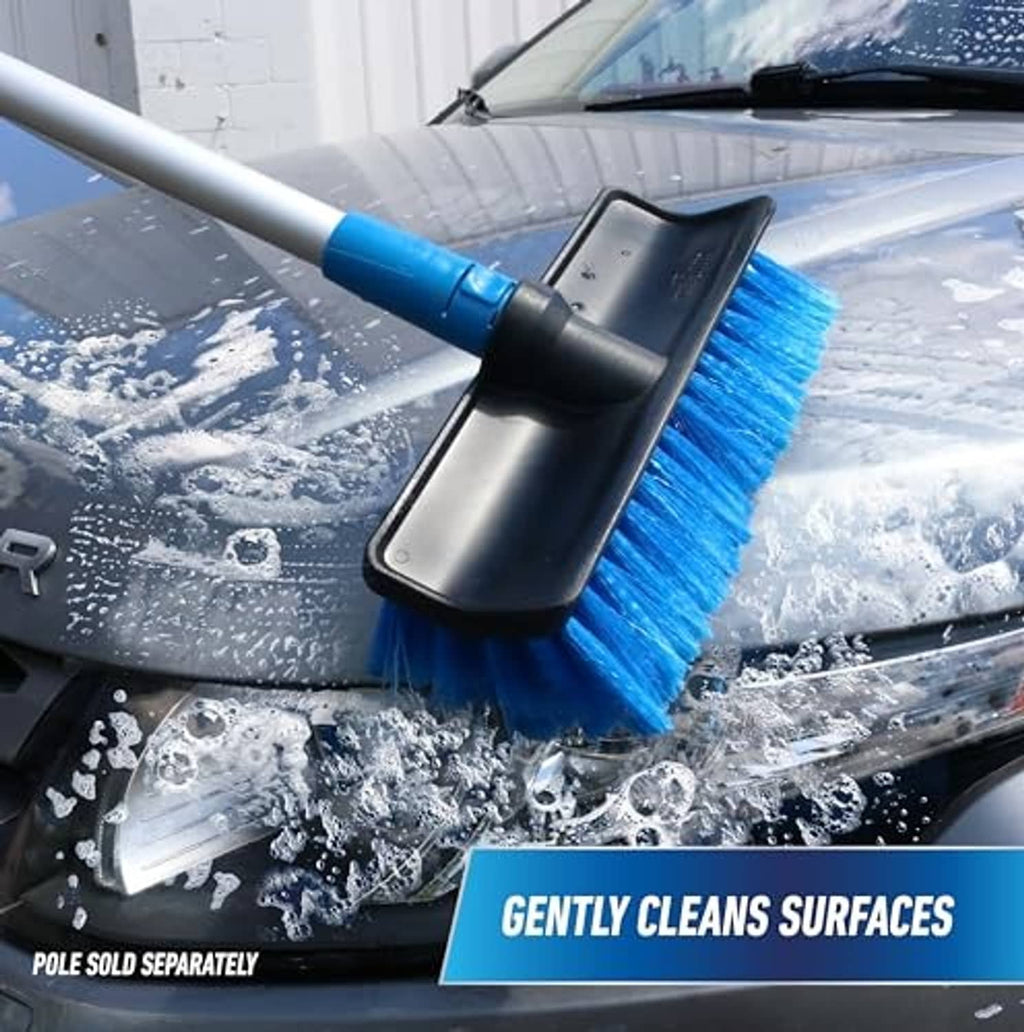 Blue soft-bristle wash brush on extension pole cleaning car windshield