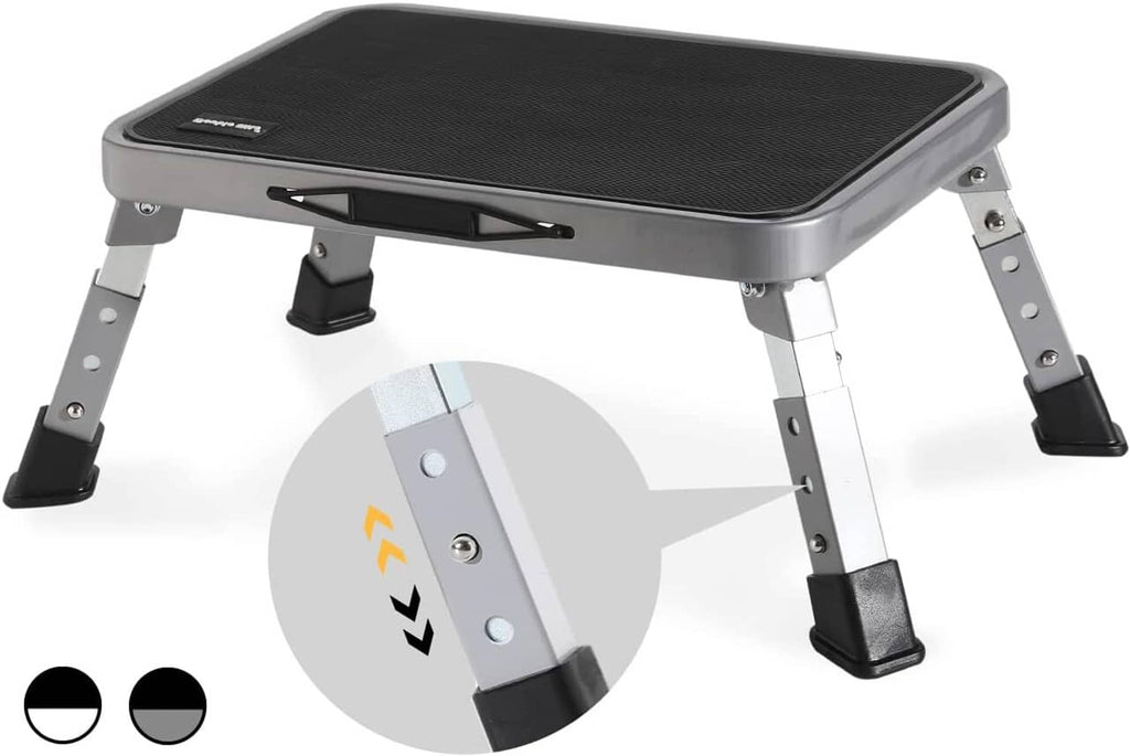 Gray and black folding step stool with textured top and four adjustable legs