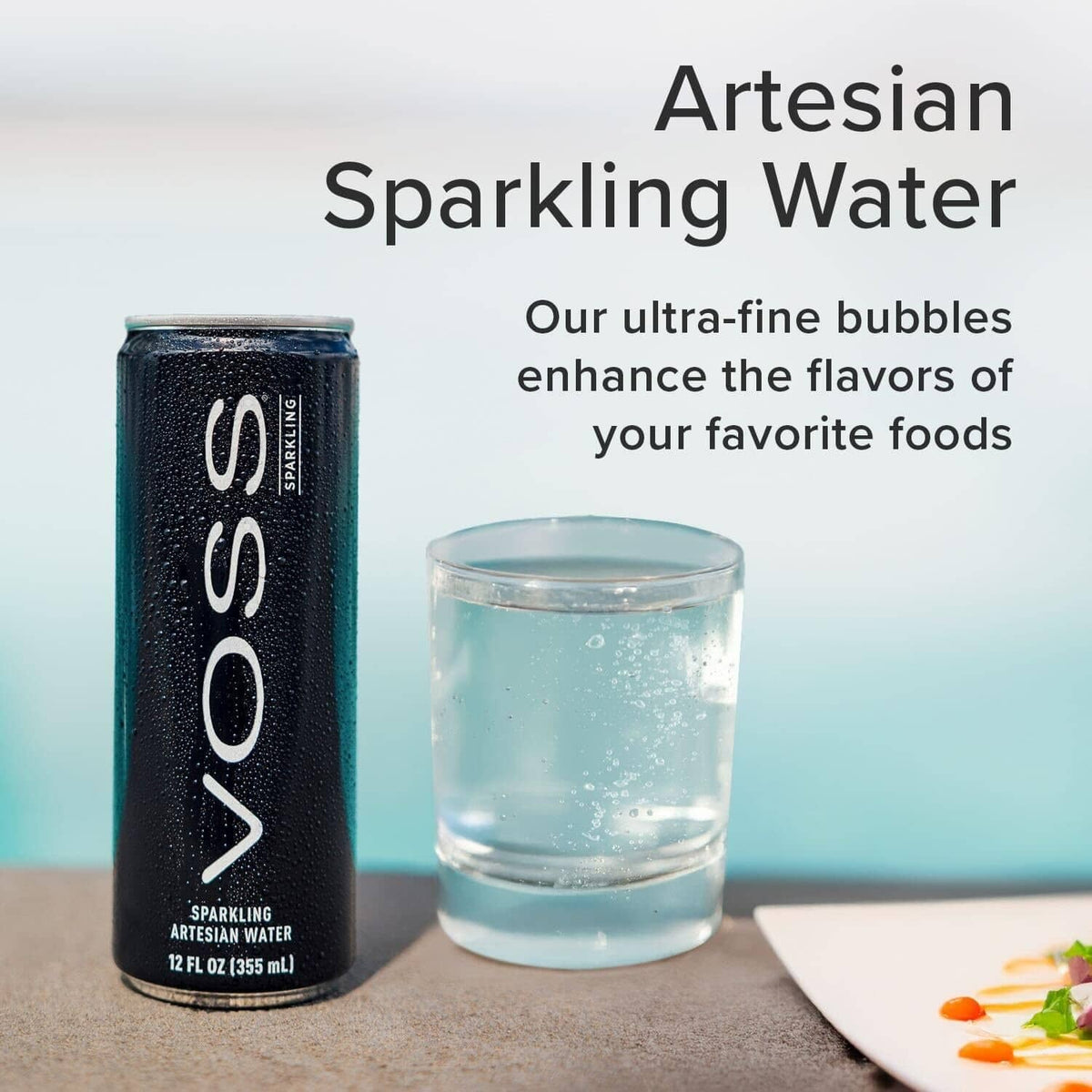VOSS Artesian sparkling water can with clear glass of water