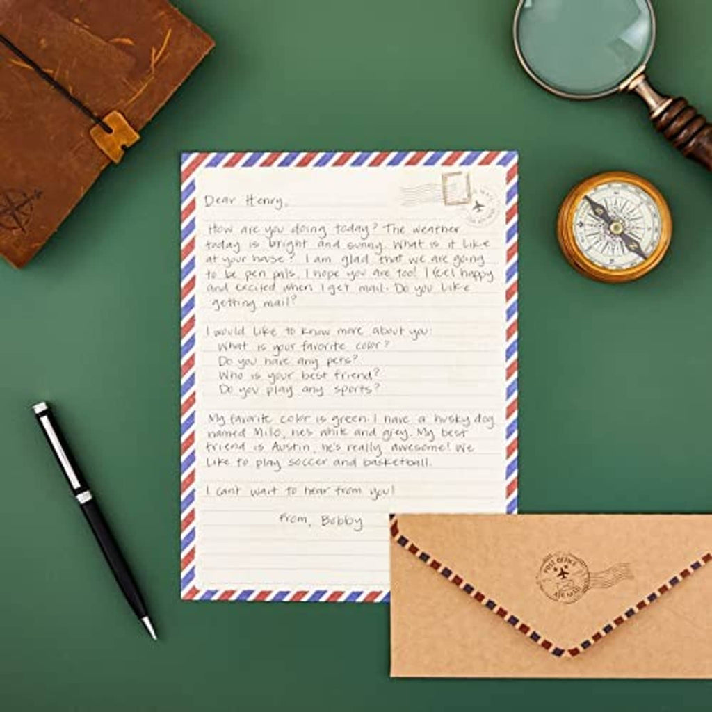 Lined letter paper with matching striped border, plus brown envelope and folded corners