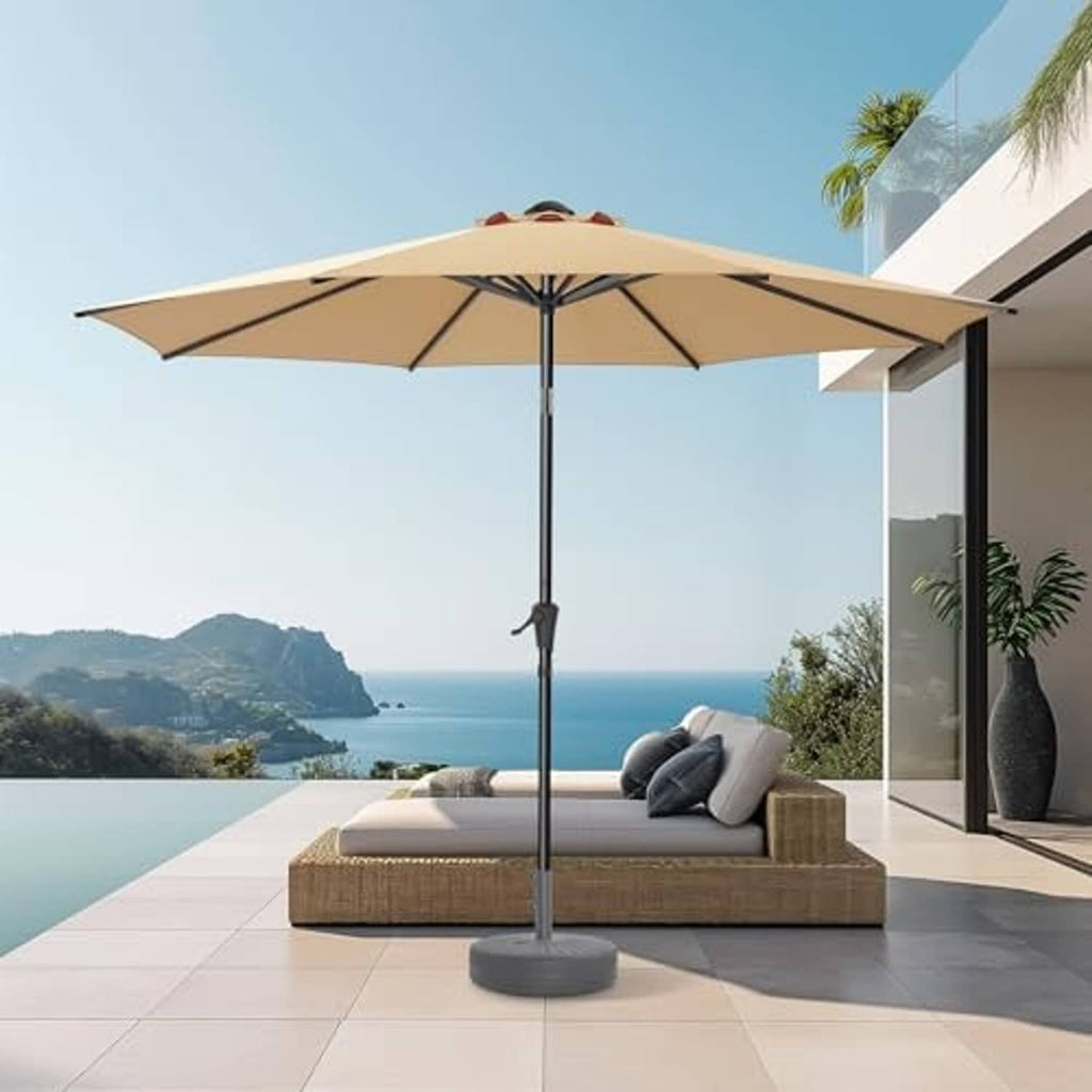 Beige outdoor patio umbrella standing over outdoor seating