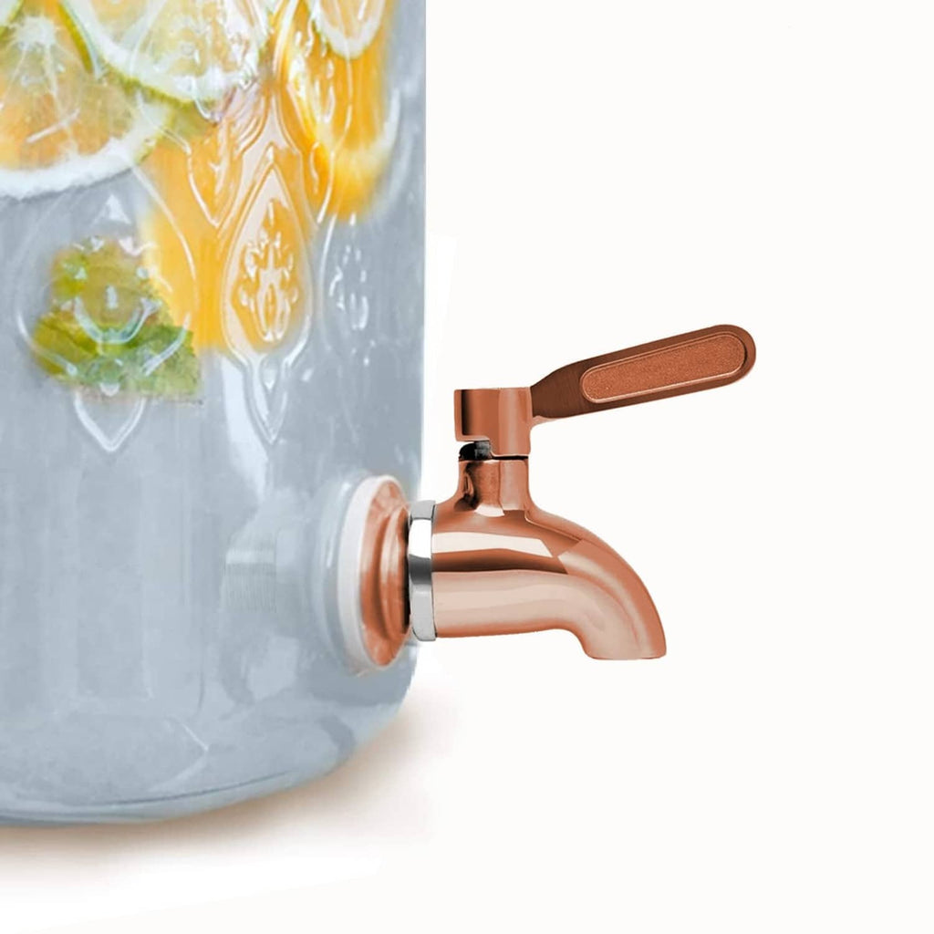 Copper and chrome beverage dispenser spigot faucet on a clear jug container