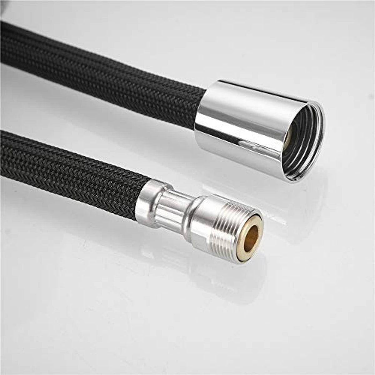 Braided hose with chrome coupling and brass threaded insert for strong, leak-resistant fitting.