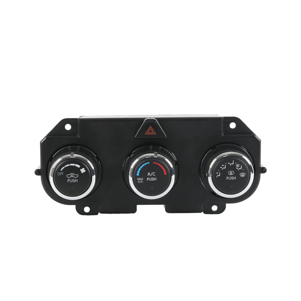 AC climate control panel with three round push-button dials and hazard indicator.