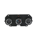 AC climate control panel with three round push-button dials and hazard indicator.