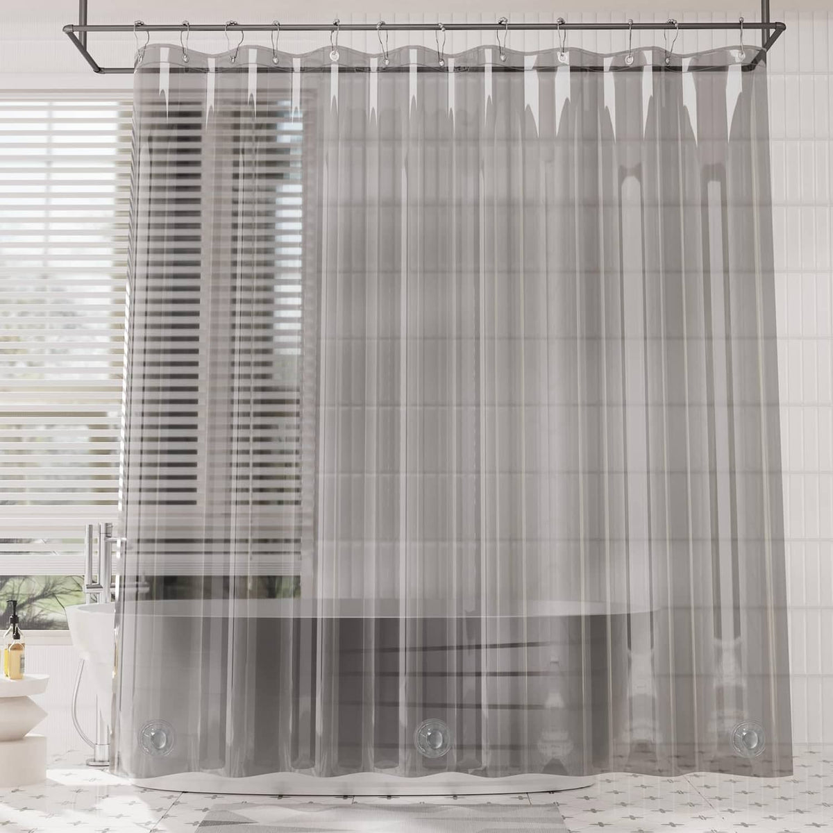 Grey clear EVA shower curtain hanging from rod with evenly spaced grommet holes