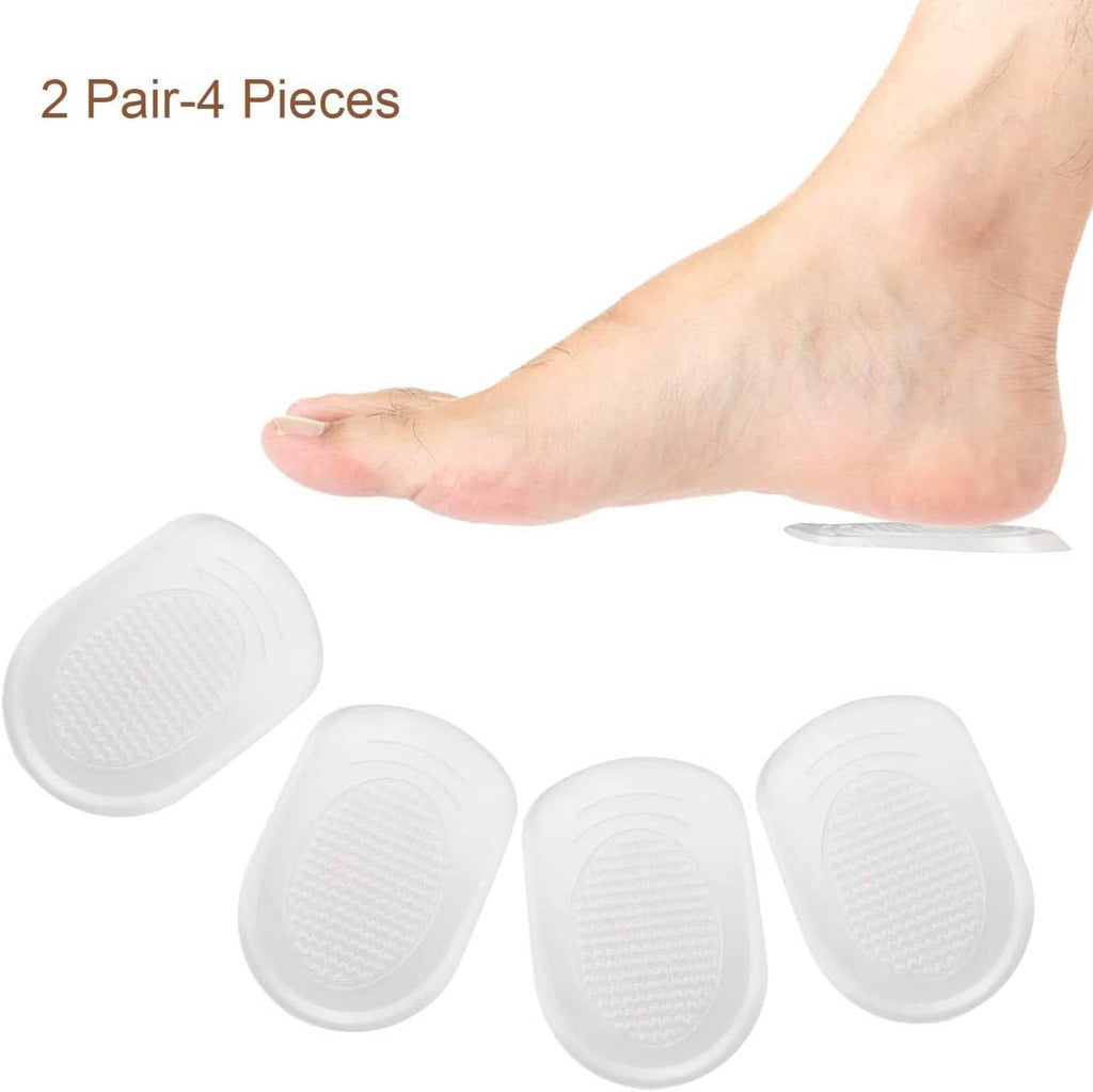 Silicone gel heel cups set: four white inserts beside a bare foot
