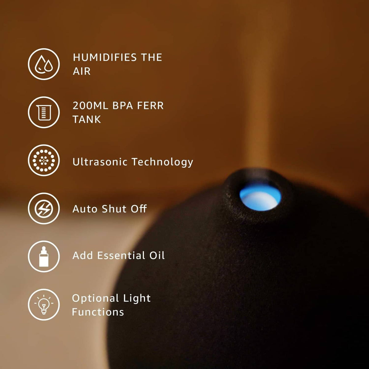 Black ceramic diffuser showing humidifying and essential oil functions with icon panel