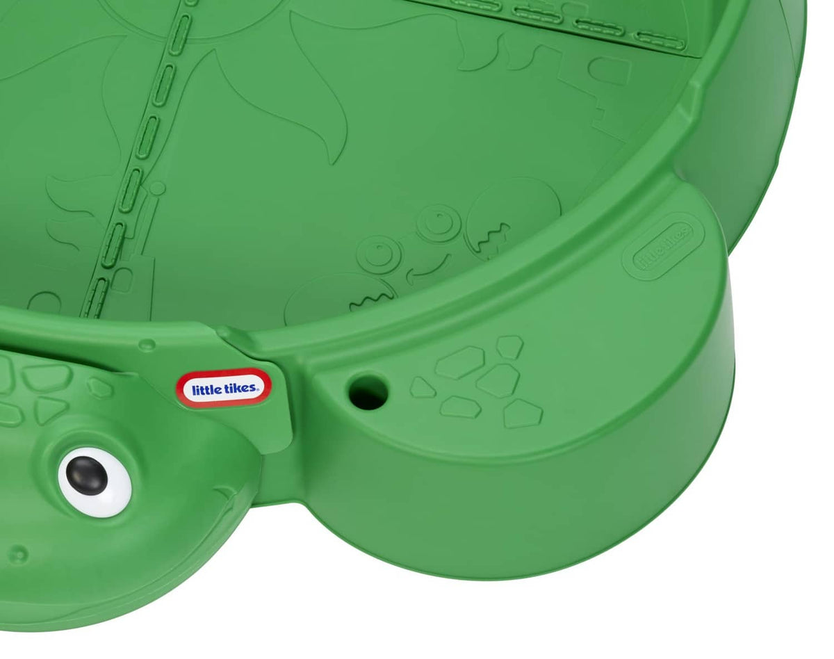 Green turtle sandbox lid underside with molded details and Little Tikes logo