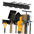 Black tool storage rack with hooks holding garden and garage tools