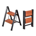 2-step folding ladder with wide wooden steps and dark non-slip feet