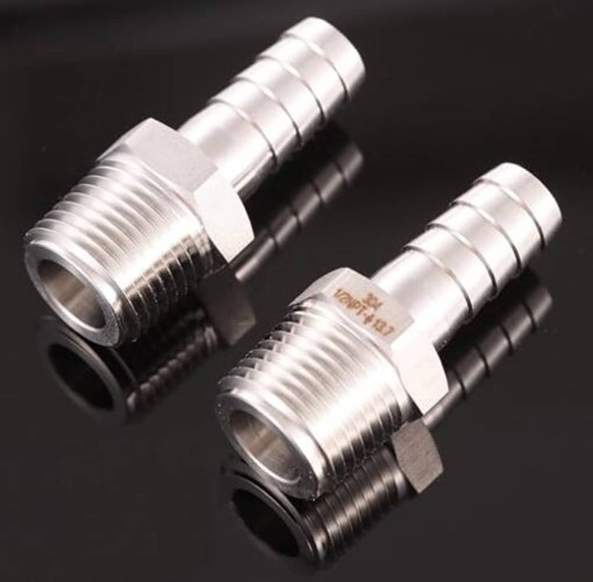 Two stainless steel hose barb to male NPT fittings with threaded male ends and barb