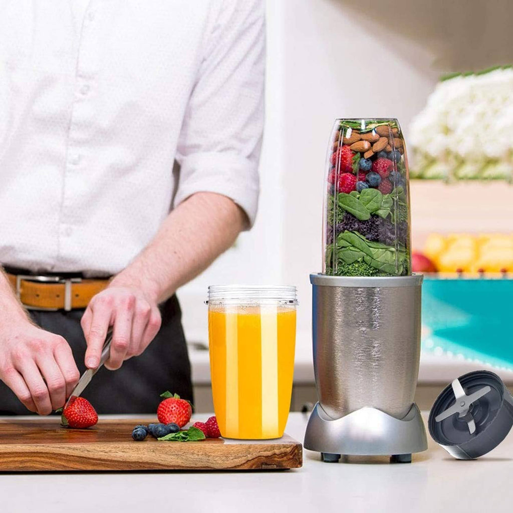 Blender cup with orange smoothie, stainless base, and detachable black blade