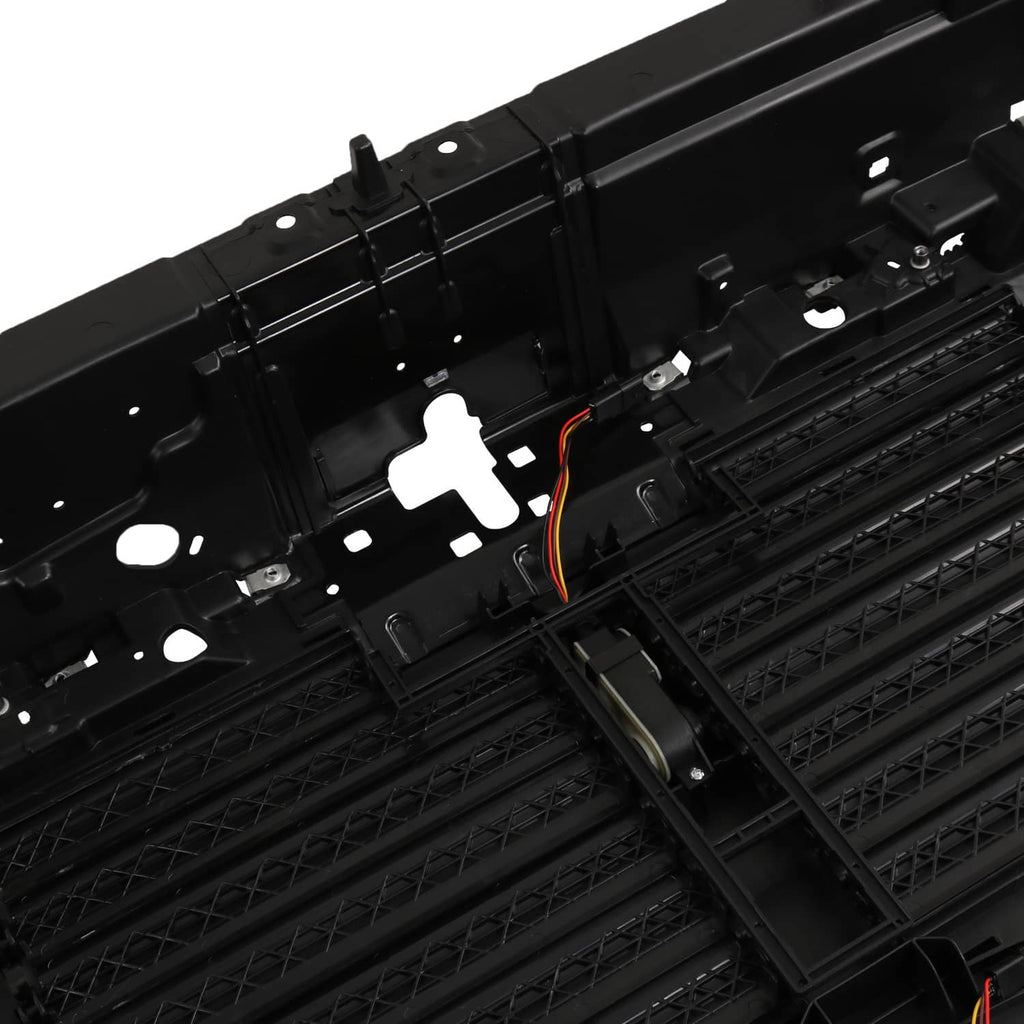 Black active grille shutter with actuator mount and visible orange wiring