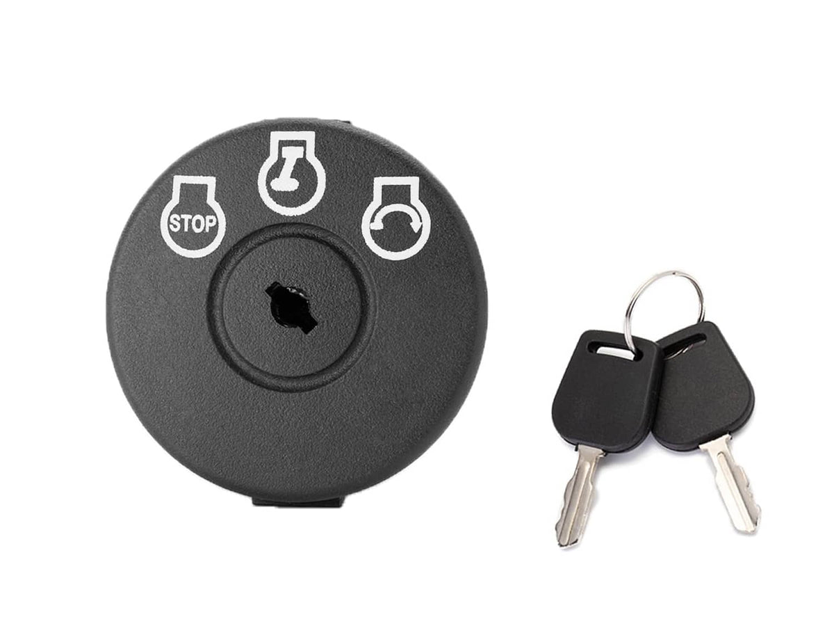 Lawn mower ignition switch with keys and dark round panel labeled stop and start