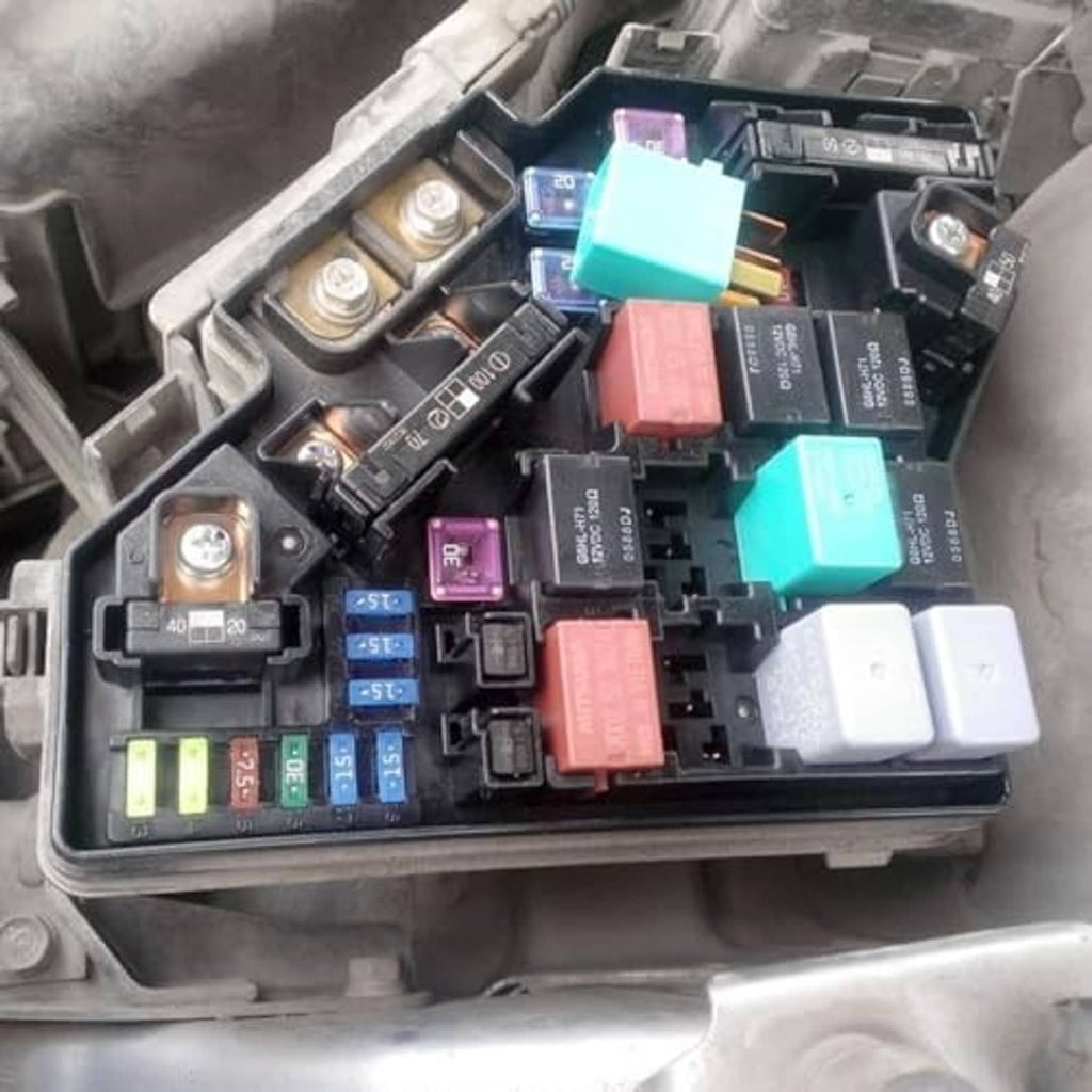 Car fuse box with multiple relays and colored fuse blocks installed