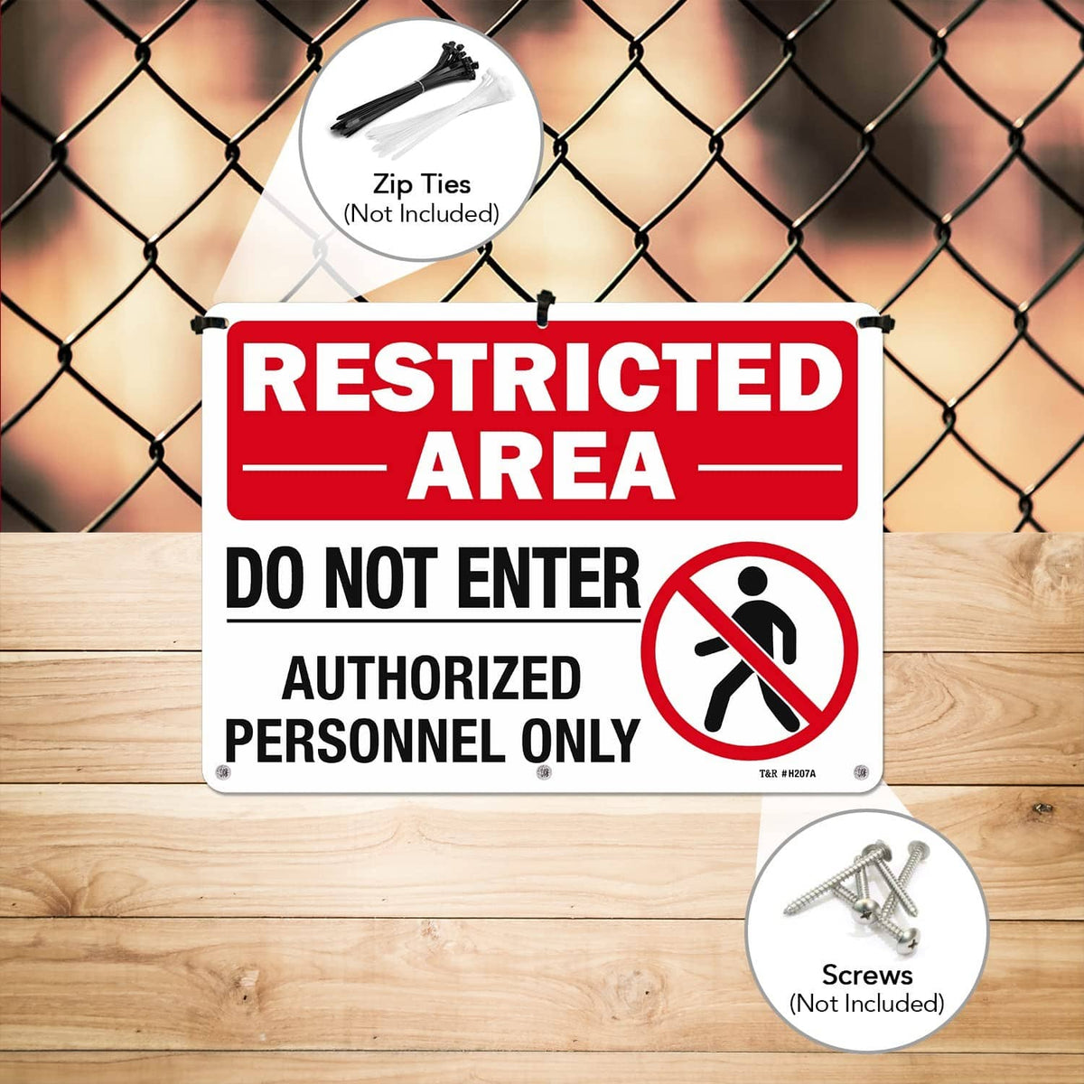 Red restricted area sign on chain-link fence, secured with zip ties shown