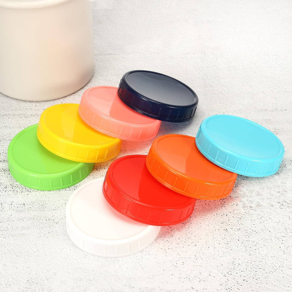 Plastic mason jar lids in assorted colors, including blue, red, green, and yellow